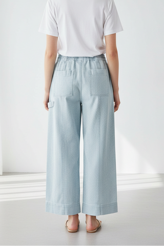 Model wearing drawstring pants - back view