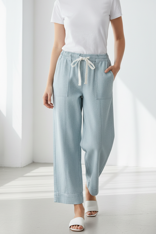 Model wearing drawstring pants front view with slides